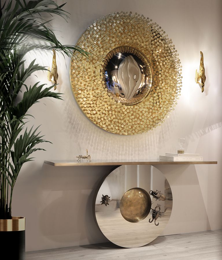 entryway with silver console and round golden mirror