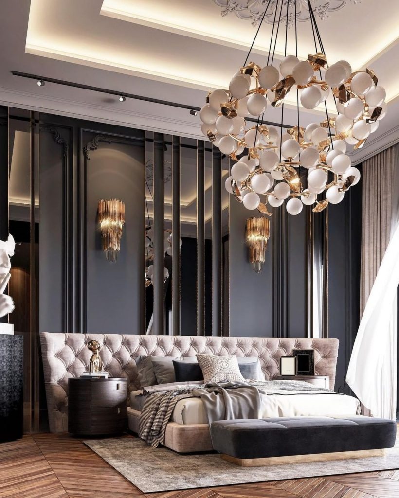 luxury bedroom with black walls and big round chandelier
