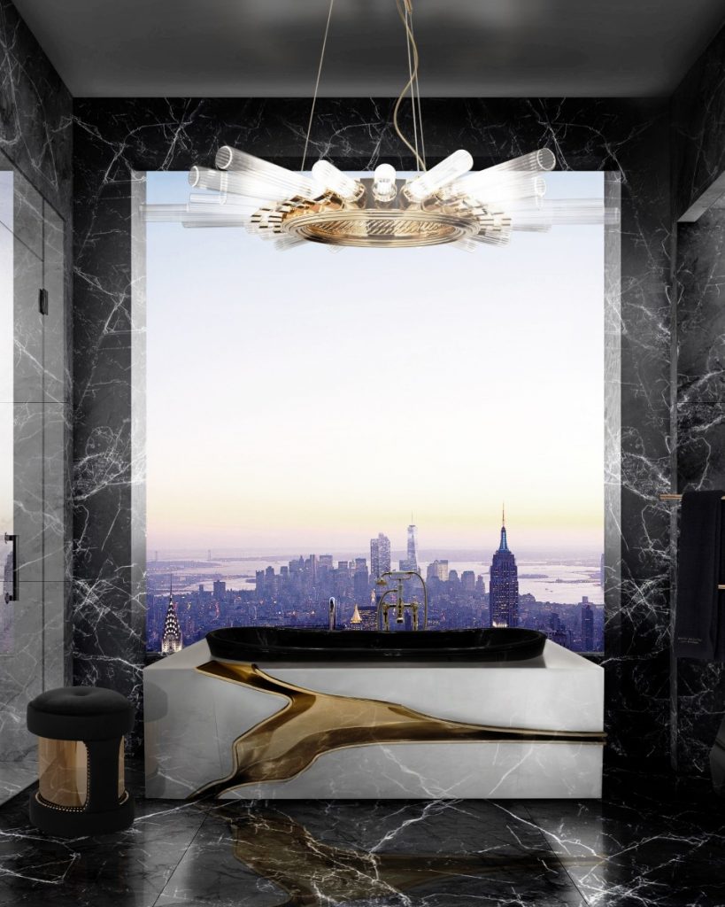 Bathroom Sets - bathroom with a view to new york, black marble floor and walls, suspension lamp, a stool in black and gold and a bathtub in white and a gold detail along the tub