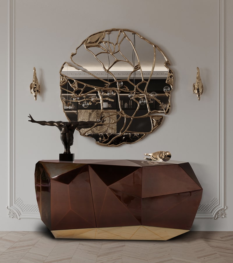 entryway with brown sideboard and a big round luxury mirror