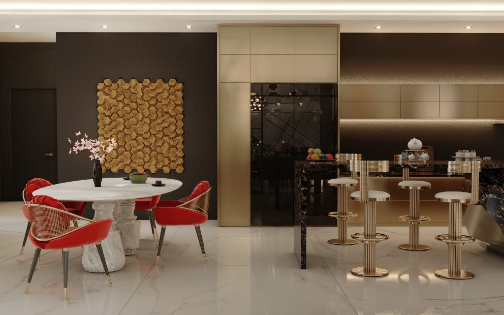 Pepe Calderin - kitchen with a white marble table with four chairs in red fabric. Four bar chairs in gold details and a high table